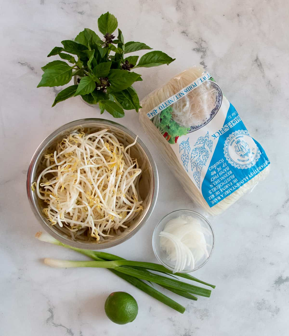thai basil, pho noodles, bean sprouts, white onion, green onion, lime